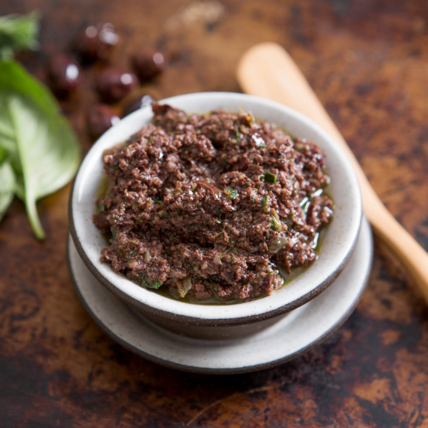 Tapenade is a Provençal name for a dish consisting of puréed or finely chopped olives, capers.