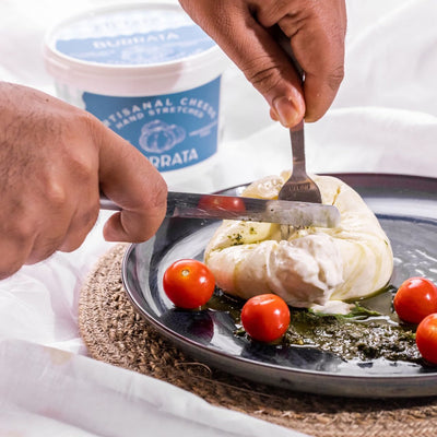 The Mozzarella exterior gives way to a luscious, milky centre of Straciatella (shreds of Mozzarella mixed with cream).
