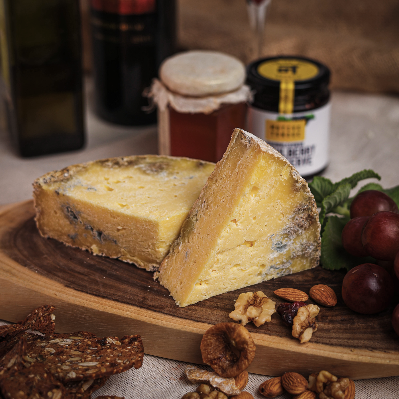 This is our play on a blue style, the cheese has two different blends of lactic and cooked cheese curds. Modelled on a Stilton, the cheese is aged below 3 months. The distinctive feature of the cheese is its blue veins across all cross sections with a bright buttery tang.