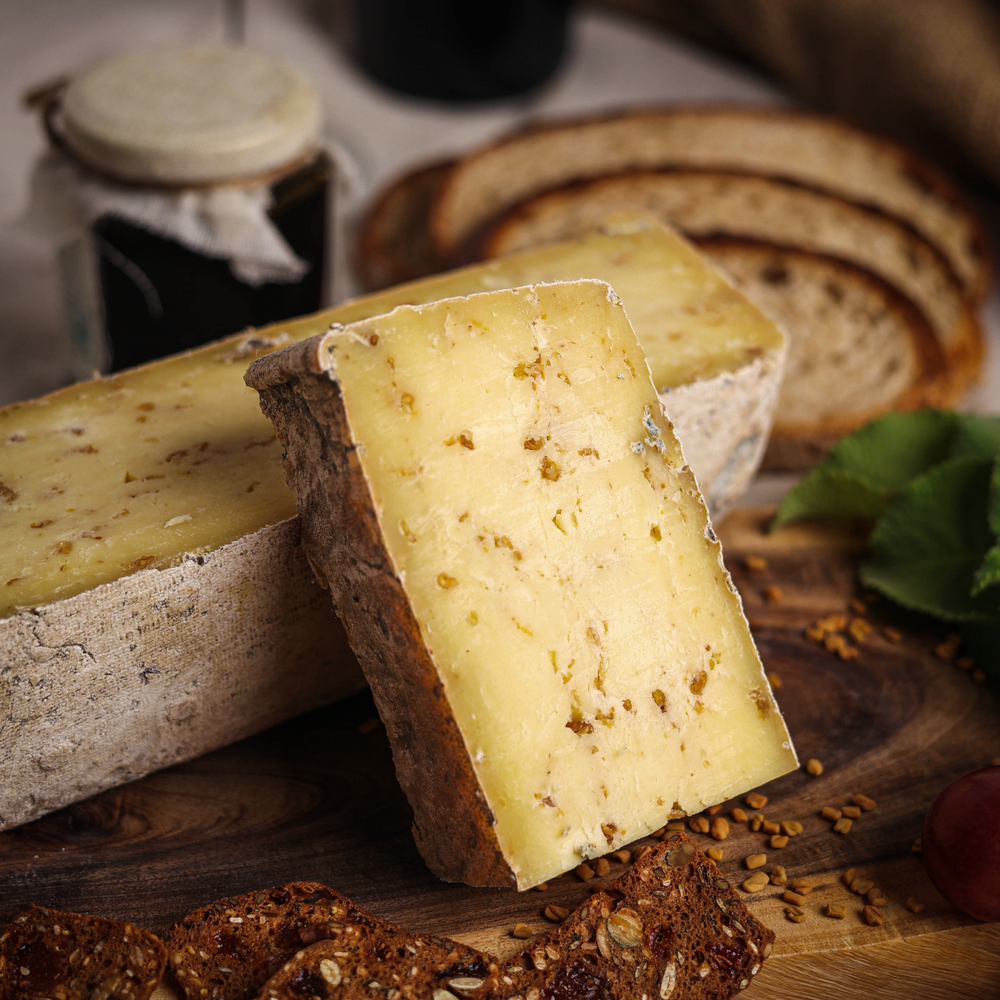 Käse Methi Cheese is a semi-hard milled curd cheese infused with organic fenugreek seeds and aged for 6-8 months.