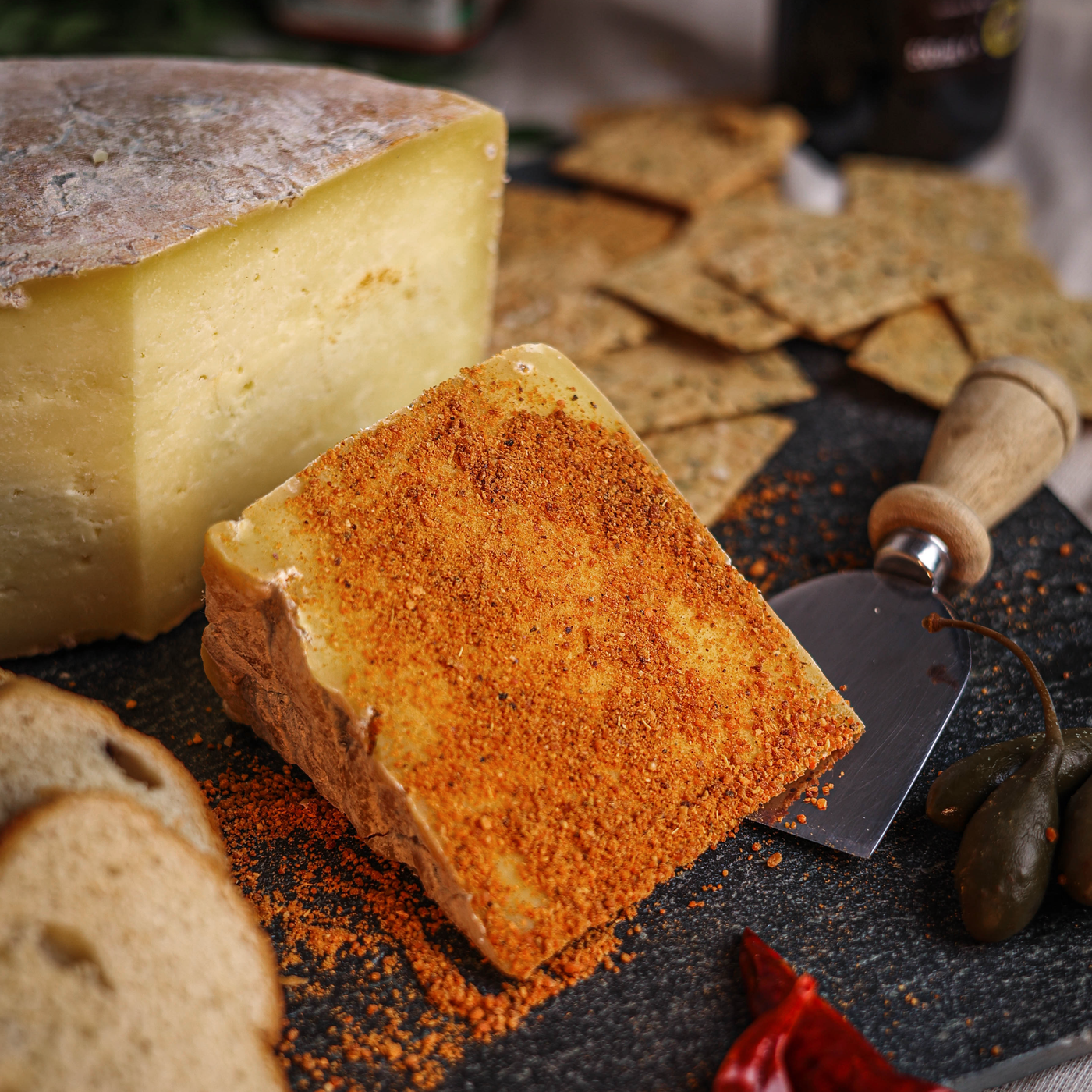 Käse Cheddar crusted with a house blend of Milagai Podi just before its packed.