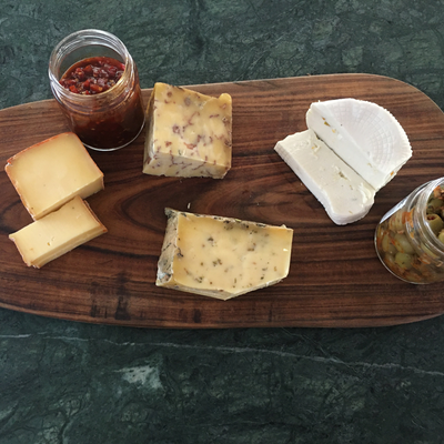 Kase monthly cheese subscription. Party platters with 4 cheeses and 2 condiments.
