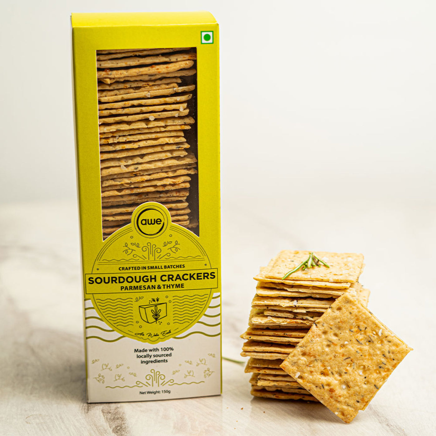 Infused with the notes of thyme and the gritty texture of parmesan, these whole-wheat sourdough crackers are a gut friendly munchy snack.